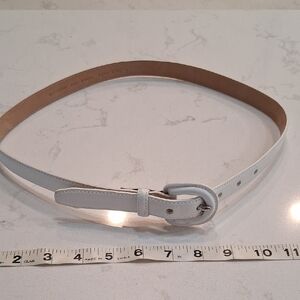 Cole Haan Tan and White Belt with Sleek Silver Buckle.